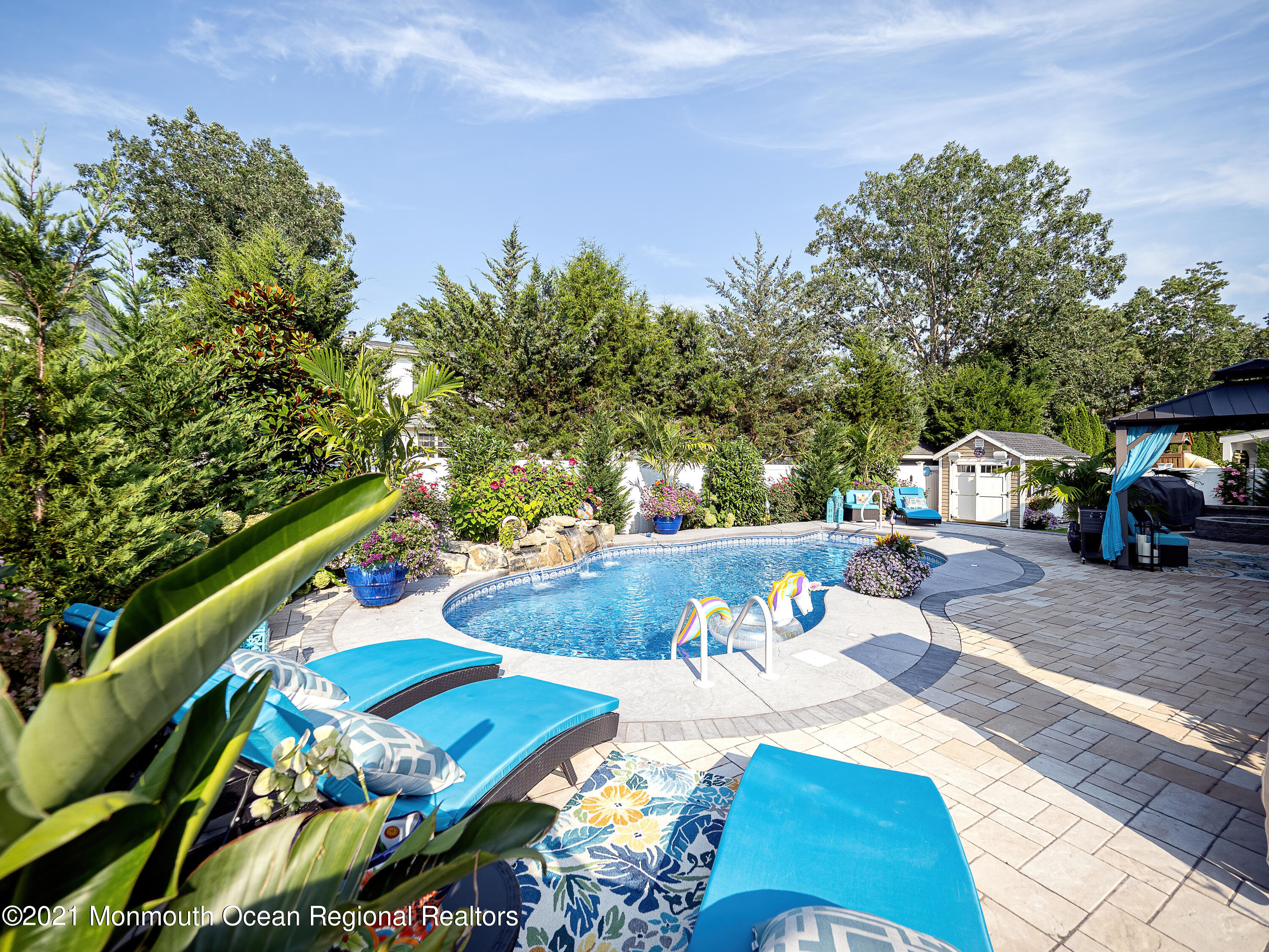 241 Privateer Road Manahawkin, NJ 08050 - Photo 22 of 44 a view of a table and chairs in the patio