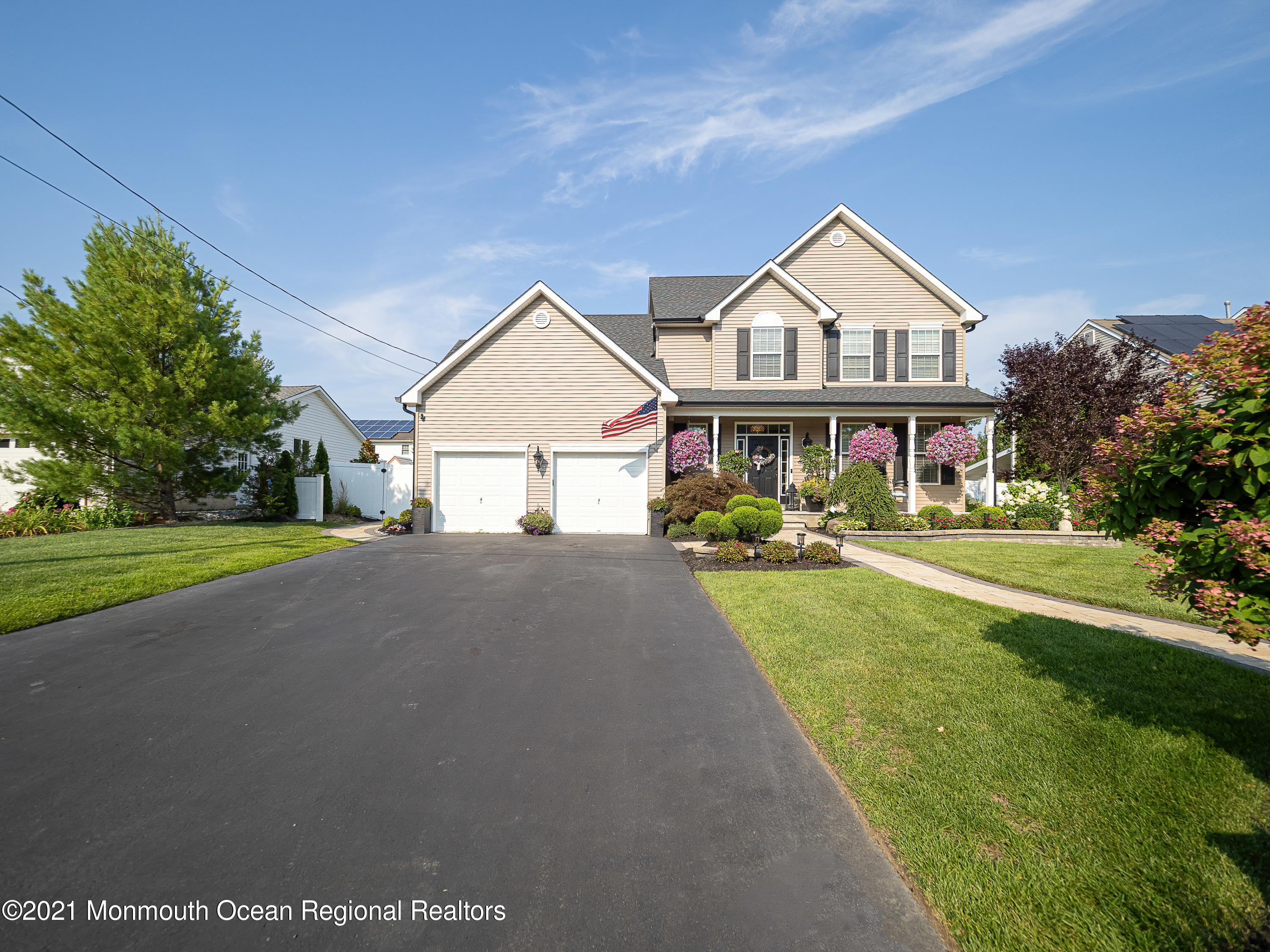 241 Privateer Road Manahawkin, NJ 08050 - Photo 24 of 44 a front view of a house with a yard