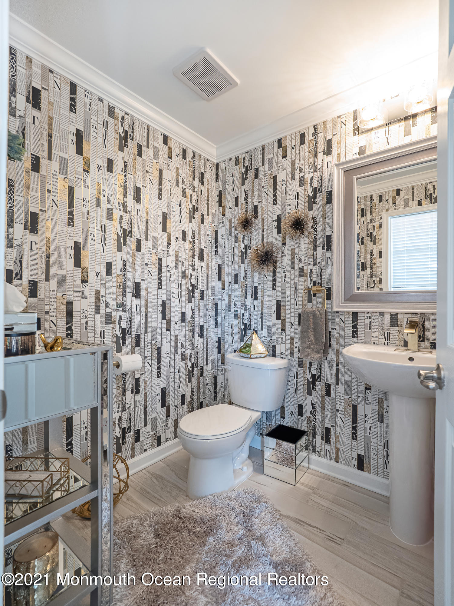 241 Privateer Road Manahawkin, NJ 08050 - Photo 29 of 44 a bathroom with a toilet a sink and a mirror