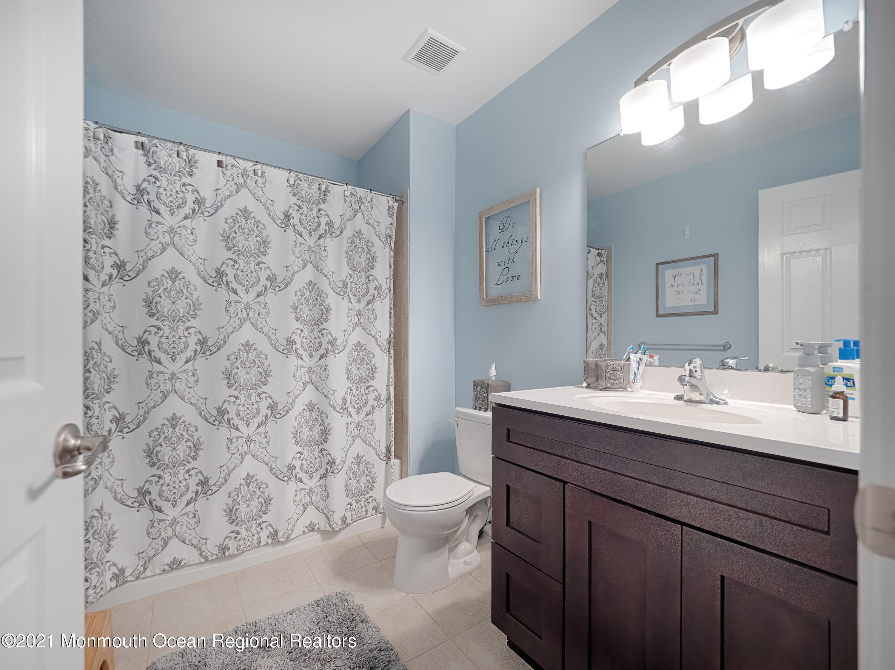 241 Privateer Road Manahawkin, NJ 08050 - Photo 32 of 44 a bathroom with a sink a toilet and a mirror