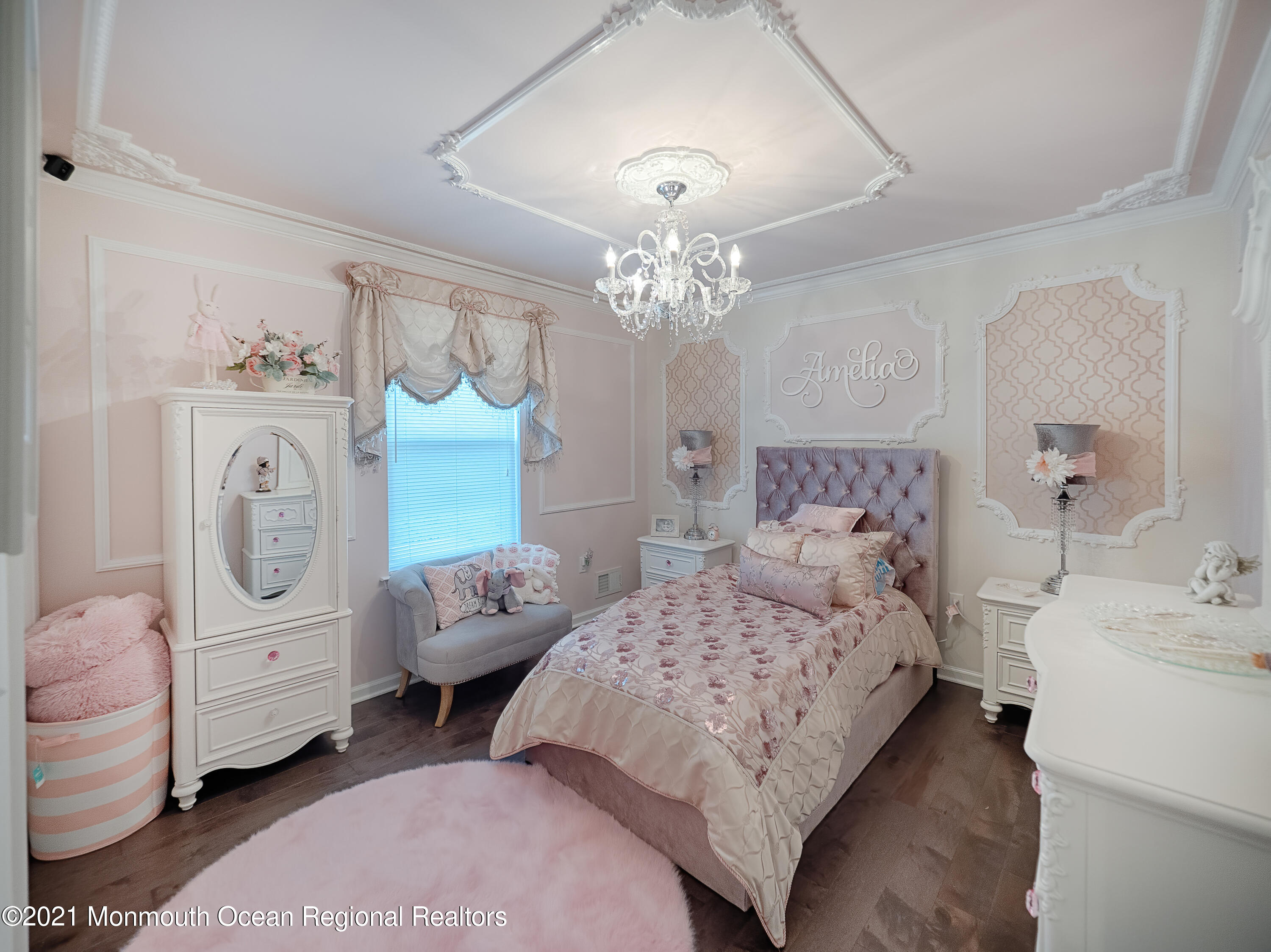 241 Privateer Road Manahawkin, NJ 08050 - Photo 33 of 44 a bedroom with a bed and a chandelier