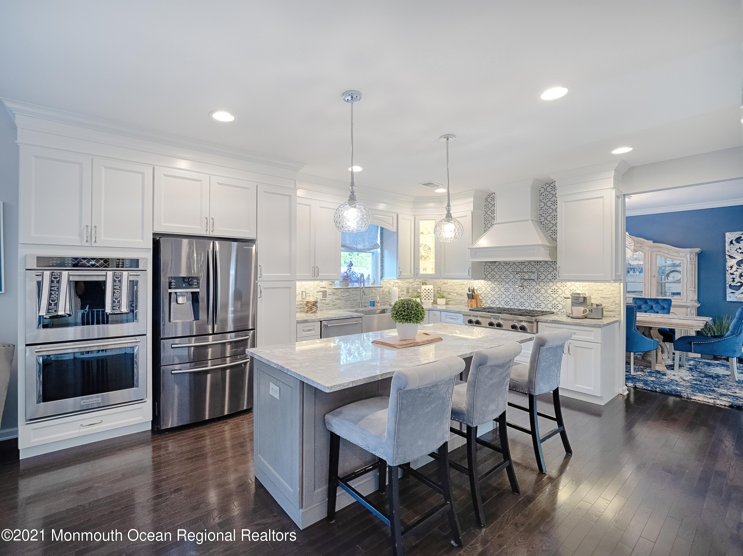 241 Privateer Road Manahawkin, NJ 08050 - Photo 38 of 44 a kitchen with stainless steel appliances a stove a sink a refrigerator and chairs