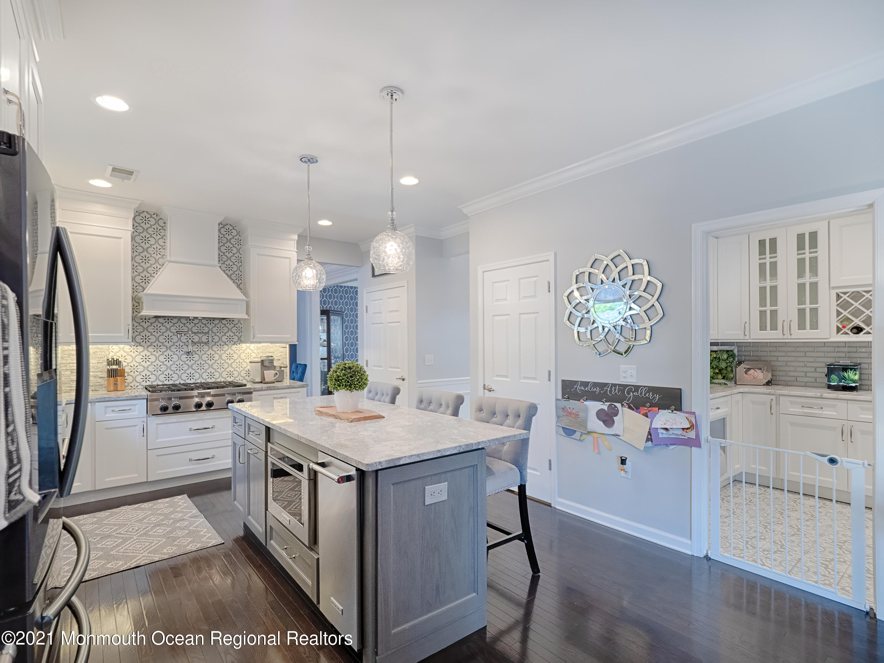 241 Privateer Road Manahawkin, NJ 08050 - Photo 39 of 44 a kitchen that has a lot of cabinets a sink and a stove in it