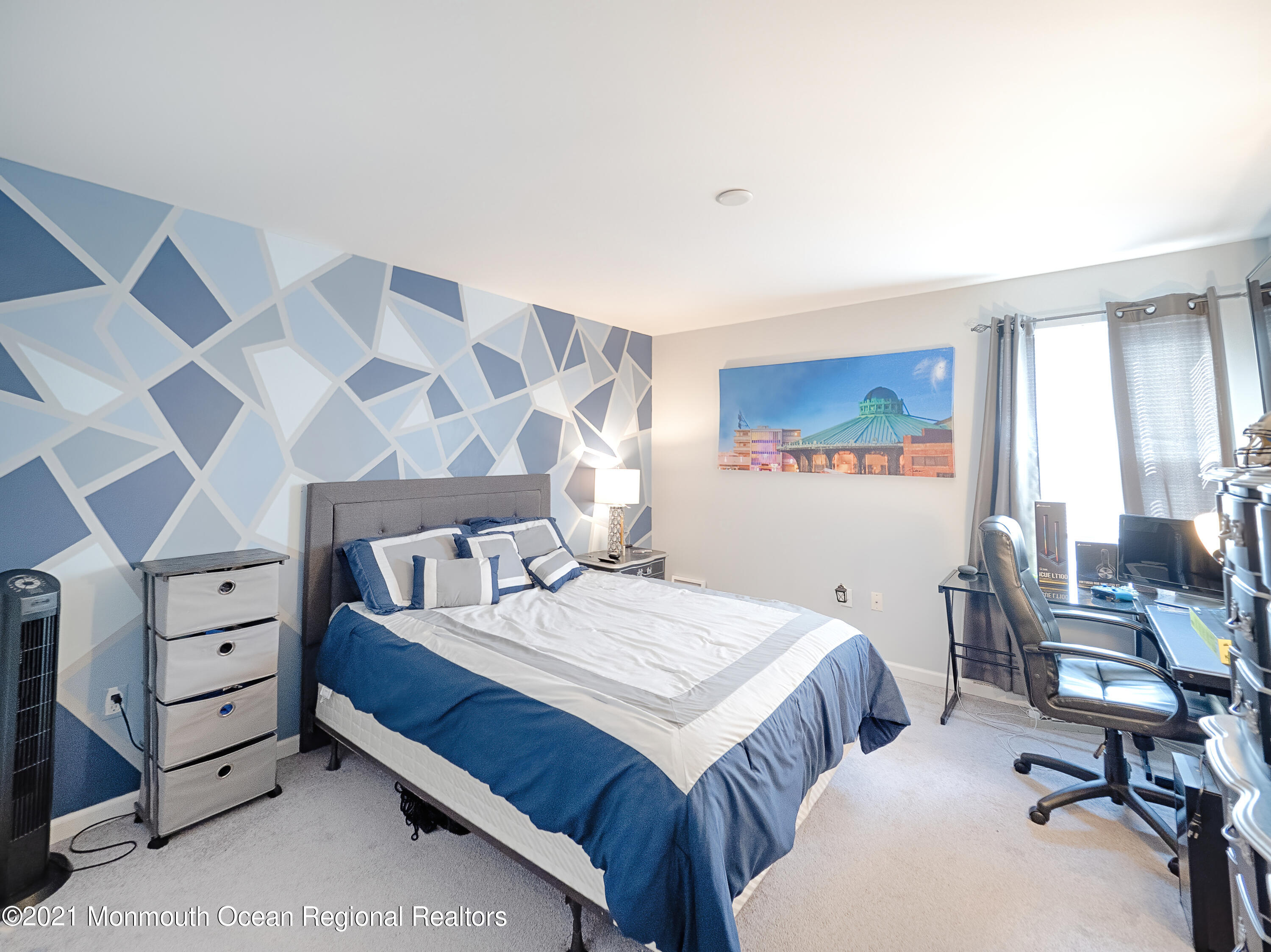 241 Privateer Road Manahawkin, NJ 08050 - Photo 43 of 44 a bedroom with a bed and a table in it