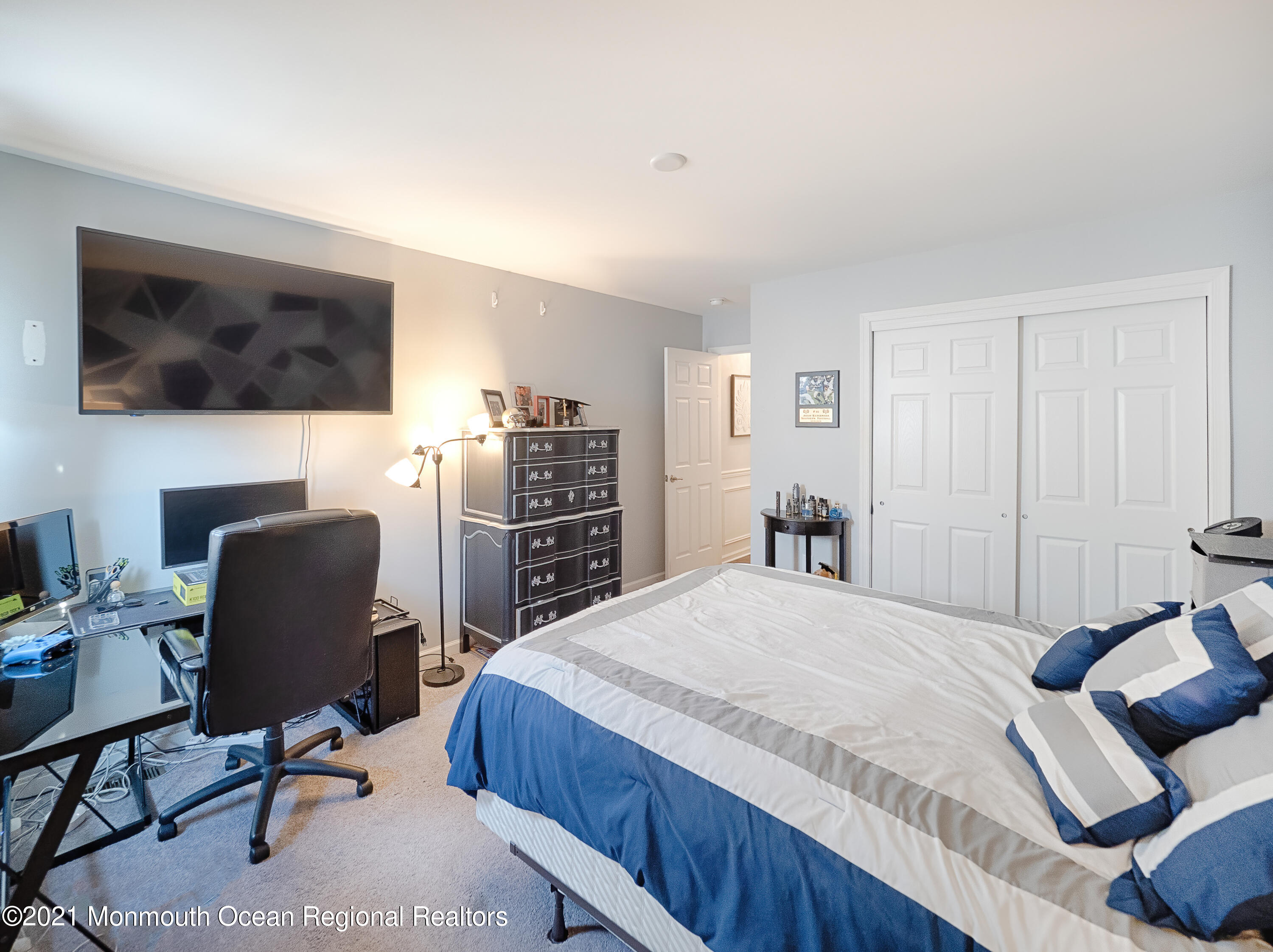 241 Privateer Road Manahawkin, NJ 08050 - Photo 44 of 44 a bedroom with a bed and a chair