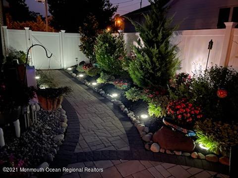 241 Privateer Road Manahawkin, NJ 08050 - Photo 7 of 44 a view of a street with flower pots