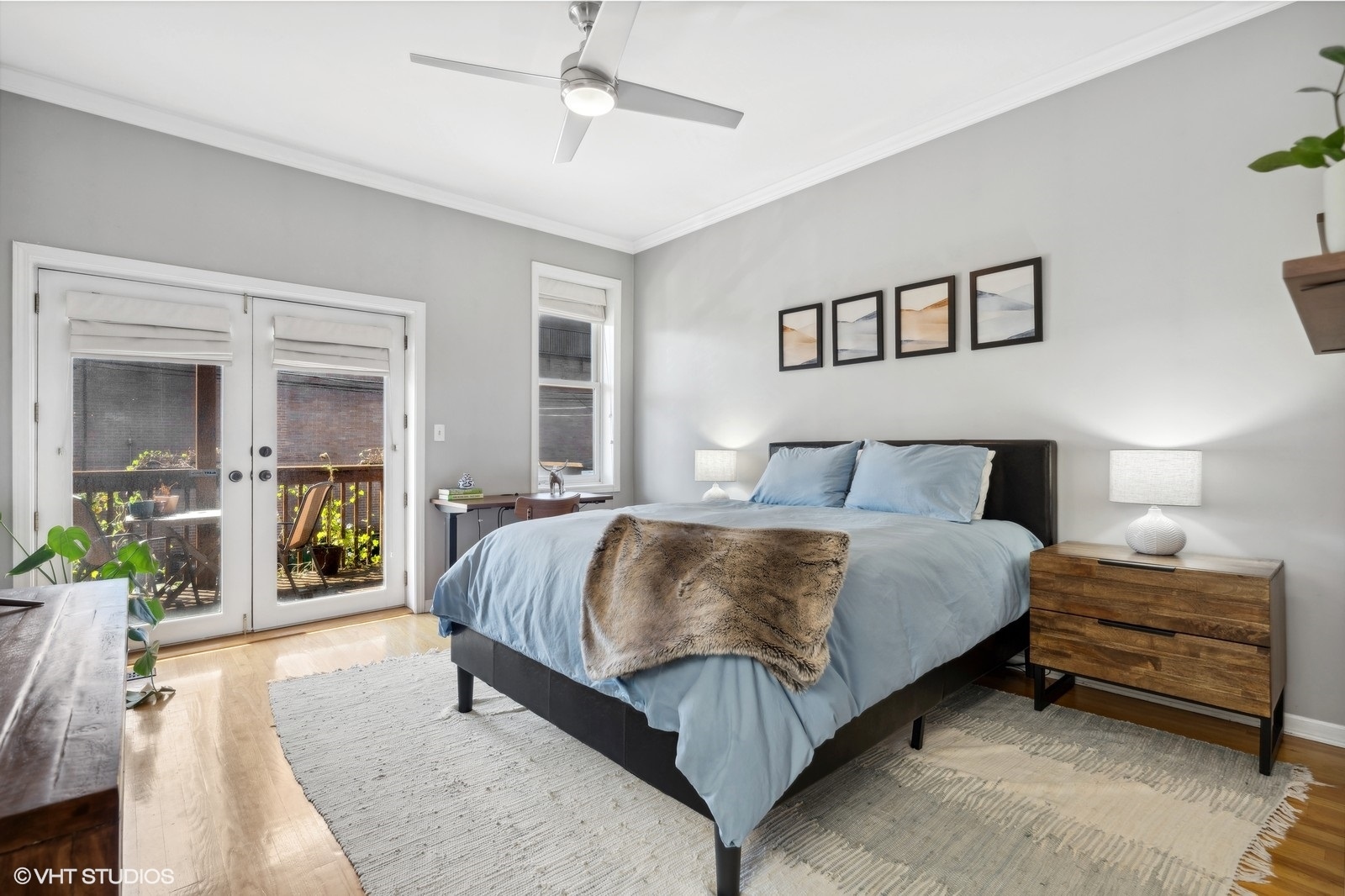 829 West Wolfram Street, Unit 2 Chicago, IL 60657 - Photo 11 of 17 a bedroom with a bed and painting on the wall