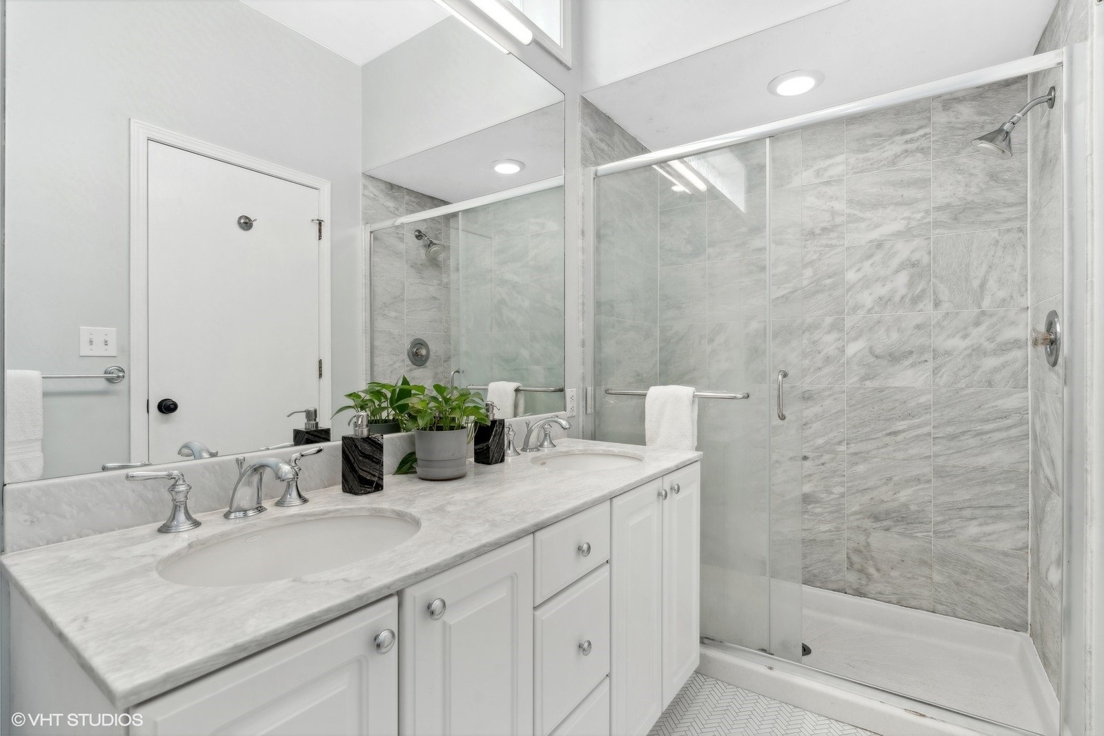 829 West Wolfram Street, Unit 2 Chicago, IL 60657 - Photo 13 of 17 a bathroom with a granite countertop sink a mirror and a shower