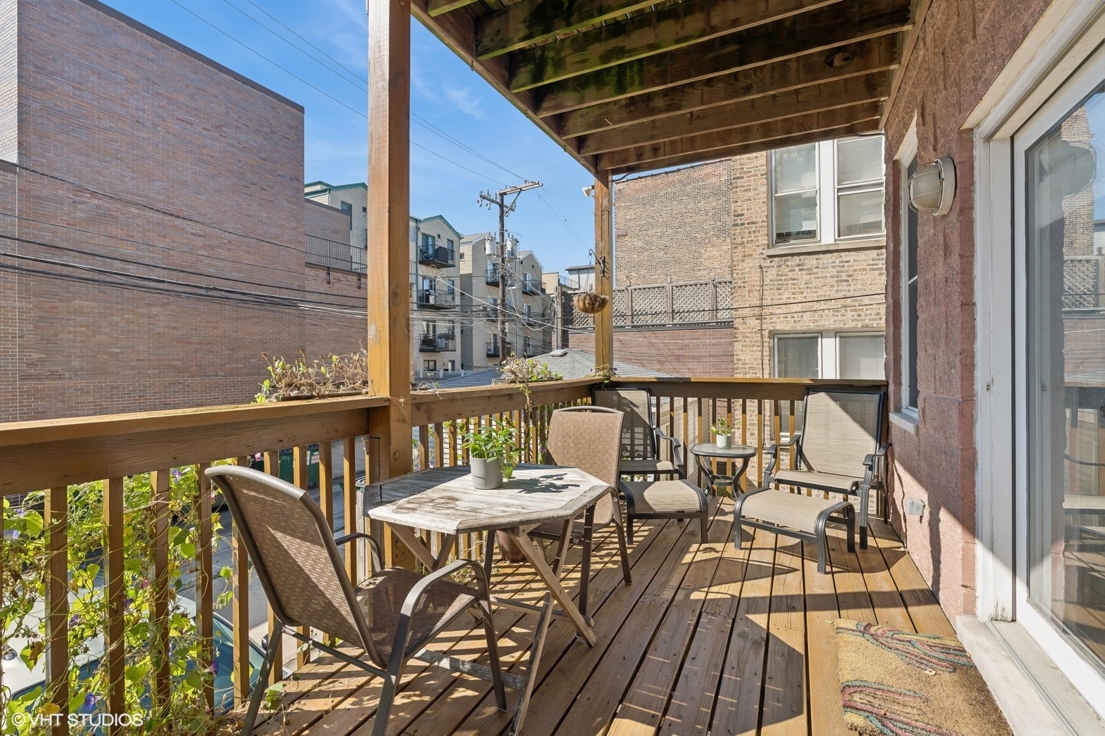 829 West Wolfram Street, Unit 2 Chicago, IL 60657 - Photo 17 of 17 a view of a balcony with wooden floor