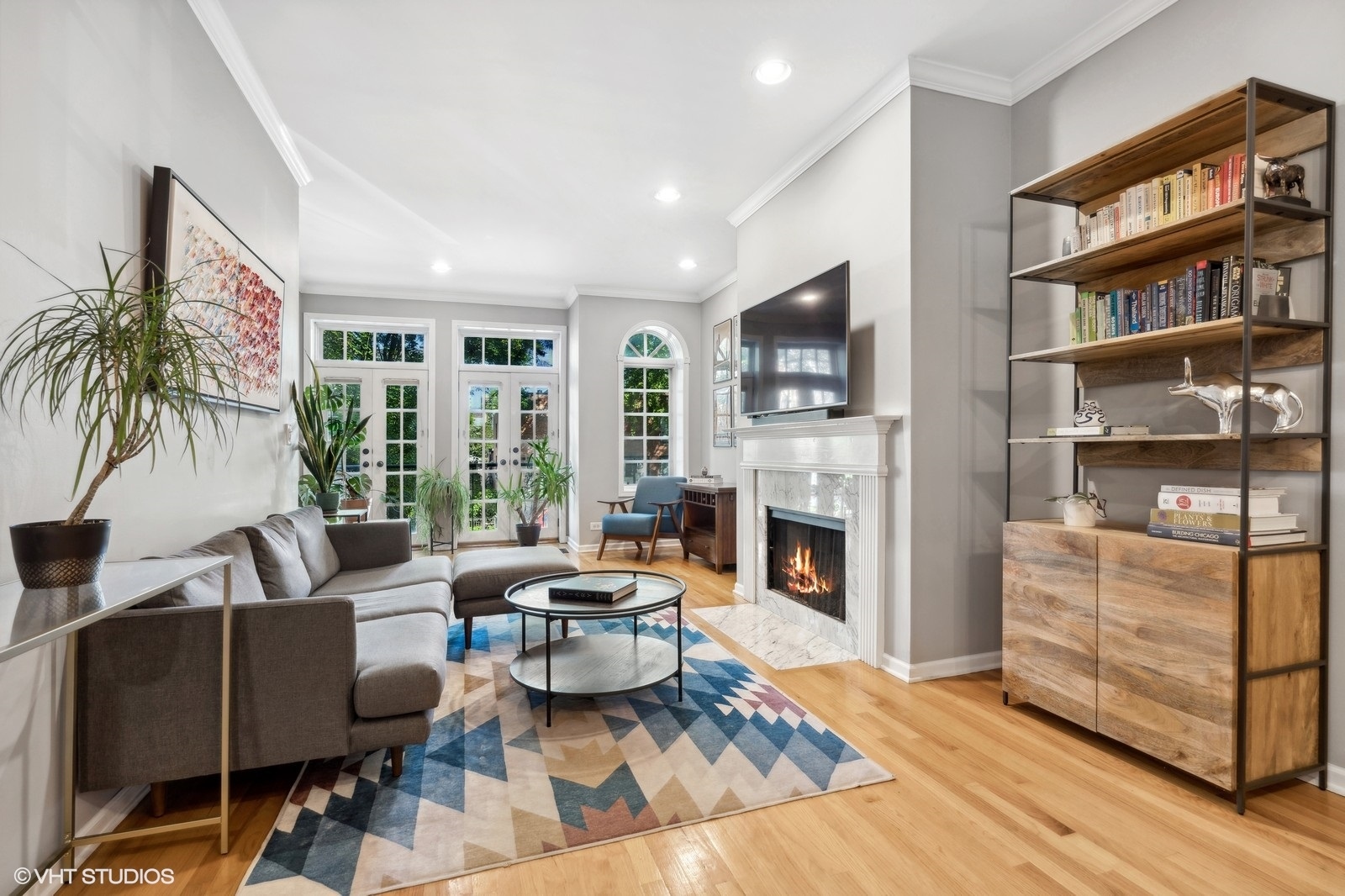 829 West Wolfram Street, Unit 2 Chicago, IL 60657 - Photo 2 of 17 a living room with furniture fireplace and a flat screen tv