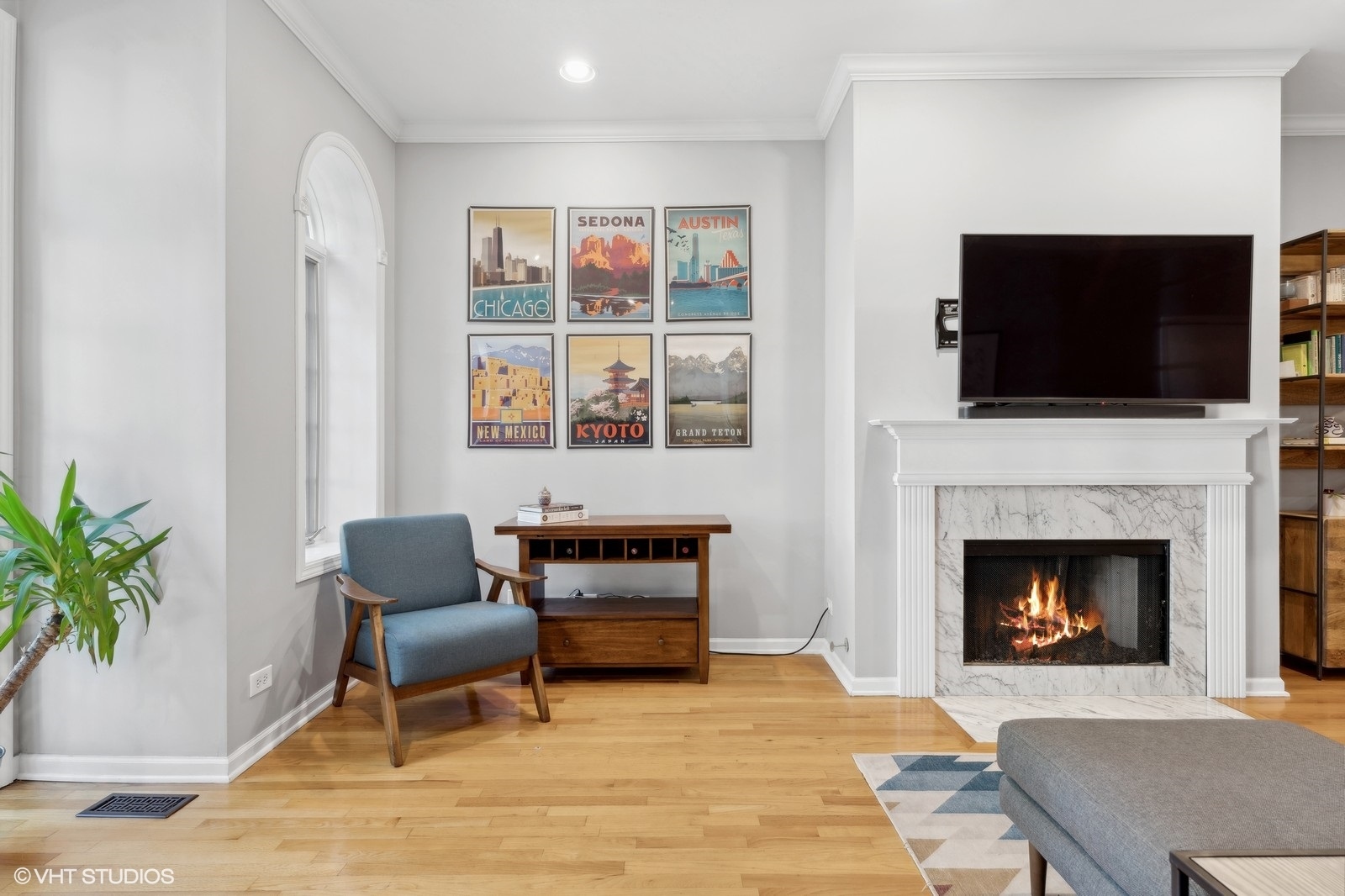 829 West Wolfram Street, Unit 2 Chicago, IL 60657 - Photo 3 of 17 a living room with furniture a flat screen tv and a fireplace