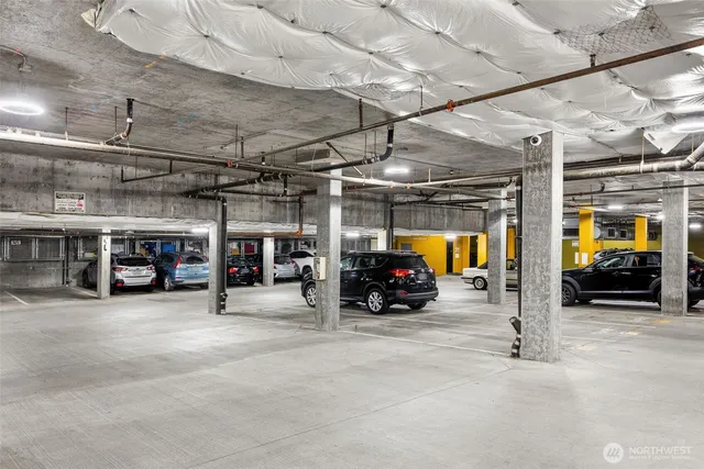 a view of parking garage with cars