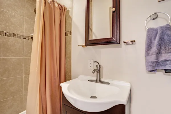 a bathroom with a sink and mirror