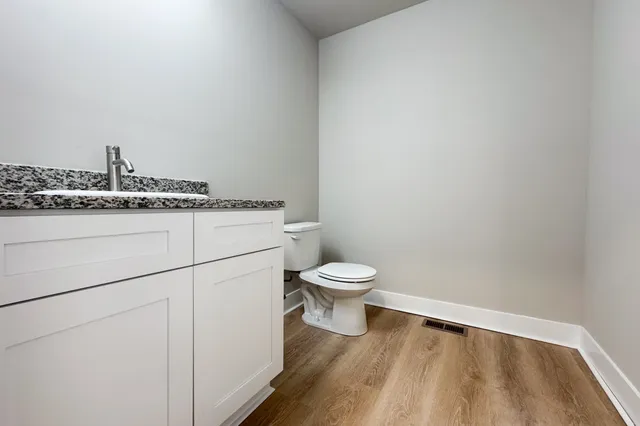 a bathroom with a toilet and a sink