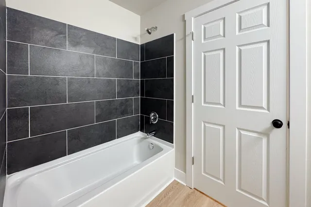 an empty room with wooden floor