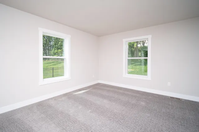 an empty room with windows