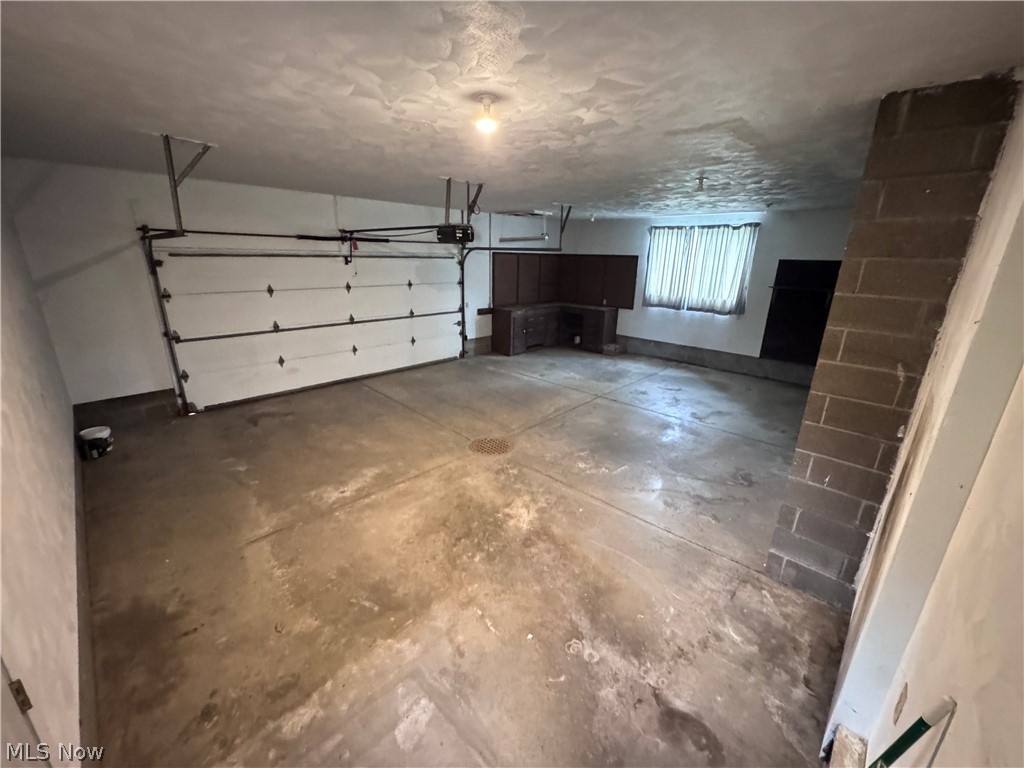 8615 Eberhart Road Northwest Dover, OH 44622 - Photo 4 of 38 2 car garage plus extra space and storage