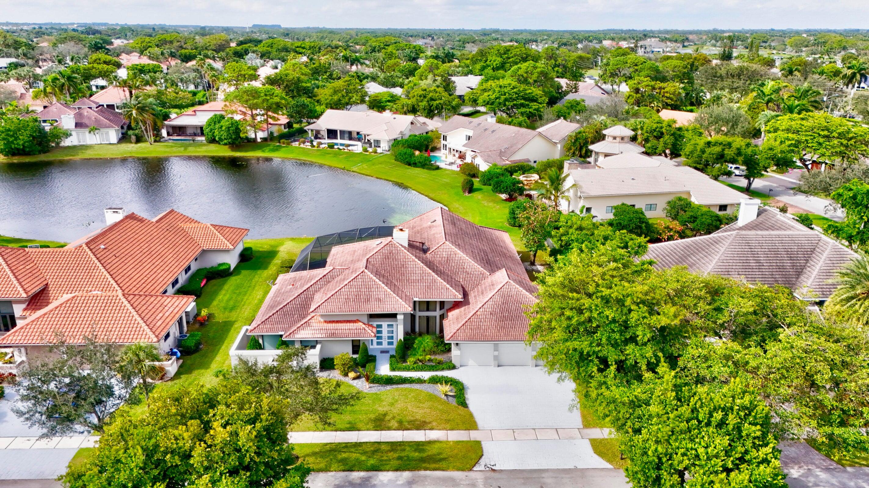 4875 Hunters Way Boca Raton, FL 33434 - Photo 40 of 43 Drone of Home and Lake