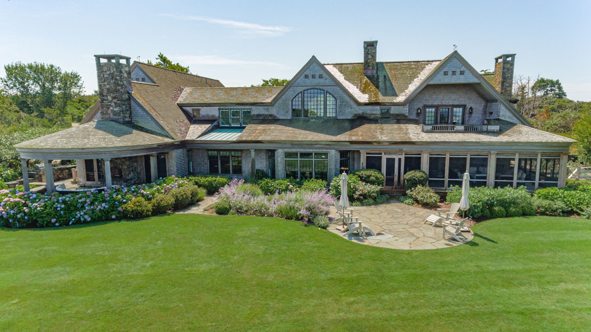 183 Polpis Road Nantucket, MA 02554 - Photo 59 of 62 a front view of a house with a yard