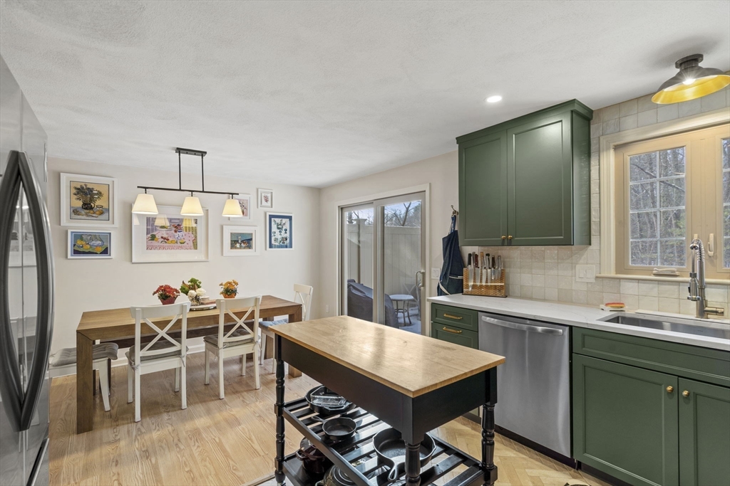 4 Apple Ridge Road, Unit 6 Maynard, MA 01754 - Photo 5 of 40 a view of a dining room with furniture and wooden floor