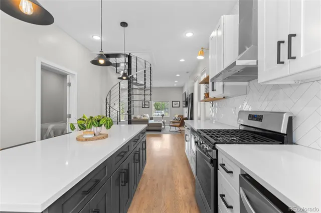 a kitchen with stove and refrigerator