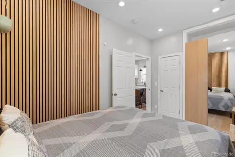 a bedroom with a bed and a walk in closet