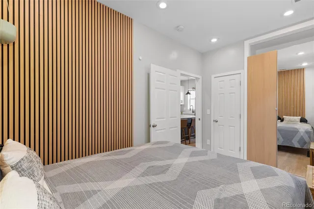 a bedroom with a bed and a walk in closet