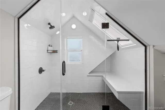 a bathroom with a shower and a sink