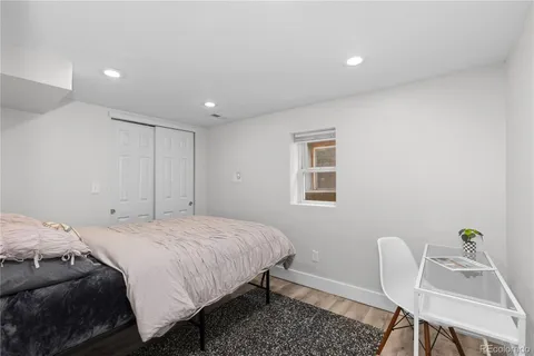 a bedroom with a bed and a chair