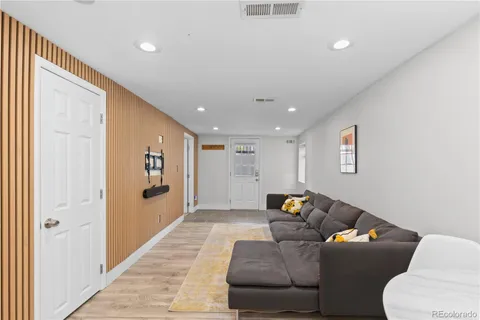 a living room with furniture and a rug