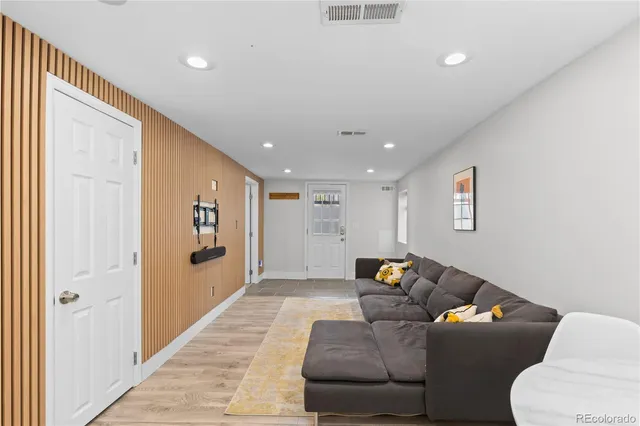 a living room with furniture and a rug