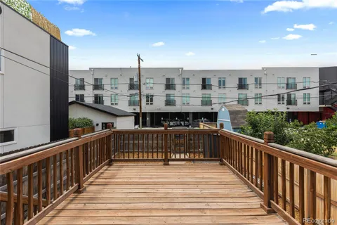 a view of balcony with wooden floor