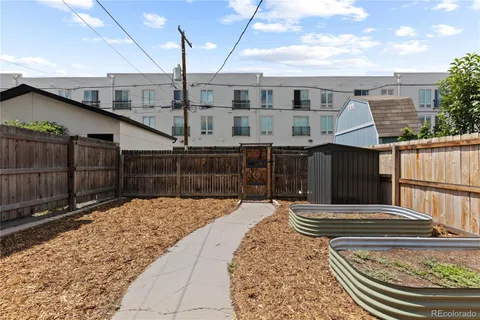 a view of a backyard with sitting area