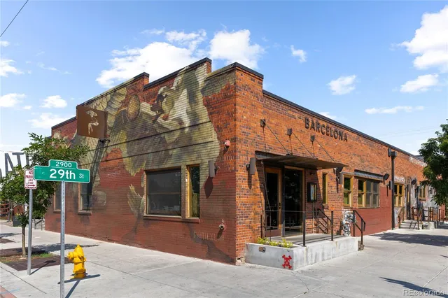 a view of a building with sitting area