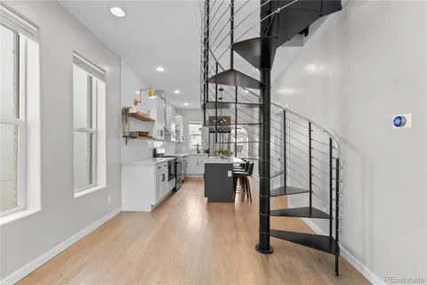 a view of kitchen with furniture and wooden floor