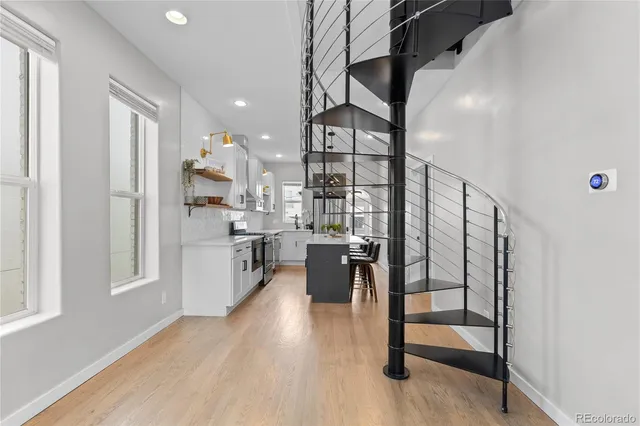 a view of kitchen with furniture and wooden floor