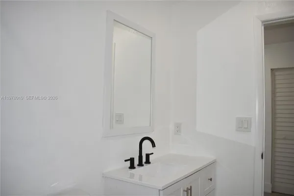 an empty room with wooden floor