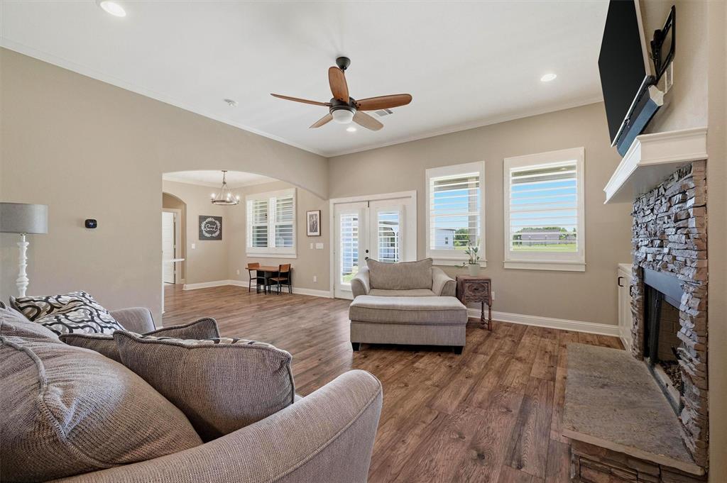 662 Preakness Place Road Van Alstyne, TX 75495 - Photo 8 of 39 a living room with furniture and a fireplace