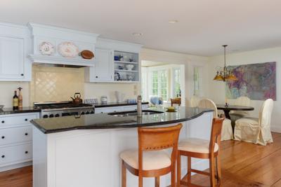 270 Stage Harbor Road Chatham, MA 02633 - Photo 12 of 25 a kitchen with stainless steel appliances granite countertop a stove a sink and a refrigerator