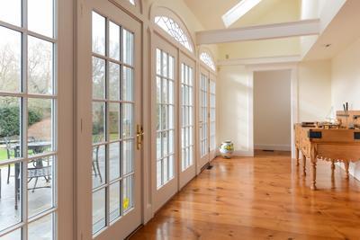 270 Stage Harbor Road Chatham, MA 02633 - Photo 15 of 25 a view of a hallway with wooden floor and dining room view
