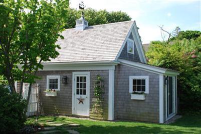 270 Stage Harbor Road Chatham, MA 02633 - Photo 4 of 25 a front view of a house with a garden
