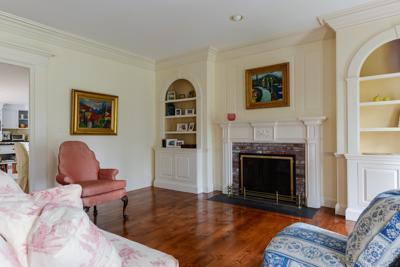 270 Stage Harbor Road Chatham, MA 02633 - Photo 9 of 25 a living room with furniture and a fireplace
