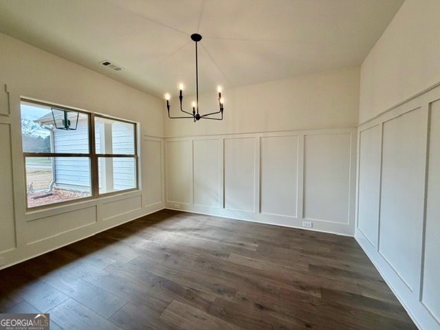 133 Kimbell Road Pine Mountain, GA 31822 - Photo 2 of 17 a view of an empty room with a window and wooden floor