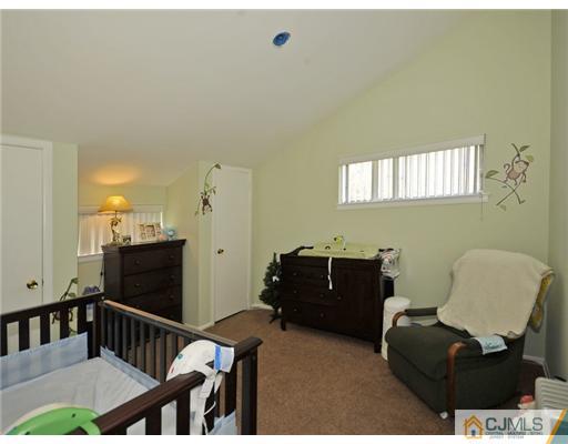 45 Rock Hill Road Old Bridge, NJ 08857 - Photo 11 of 14 a living room with furniture and a window