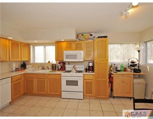 45 Rock Hill Road Old Bridge, NJ 08857 - Photo 4 of 14 a kitchen with a sink and cabinets