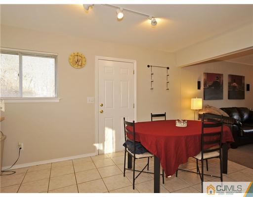 45 Rock Hill Road Old Bridge, NJ 08857 - Photo 5 of 14 a view of a dining room with furniture and a window