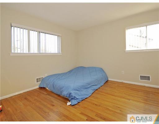 45 Rock Hill Road Old Bridge, NJ 08857 - Photo 9 of 14 a bedroom with a bed and a window