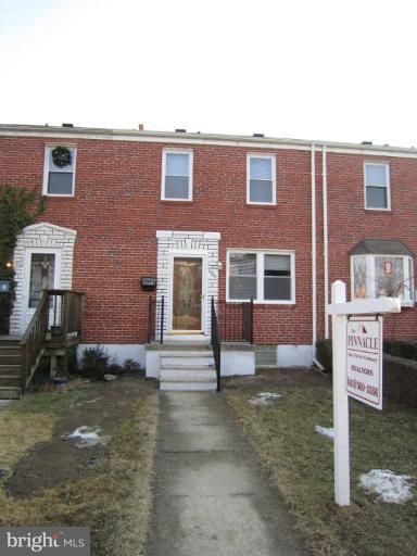 1725 Pin Oak Road Parkville, MD 21234 - Photo 1 of 18 a front view of a house with a yard