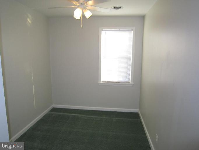 1725 Pin Oak Road Parkville, MD 21234 - Photo 14 of 18 an empty room with a window