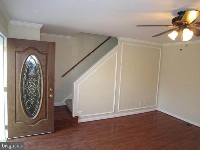 1725 Pin Oak Road Parkville, MD 21234 - Photo 5 of 18 a view of a livingroom with furniture and bathroom with a mirror